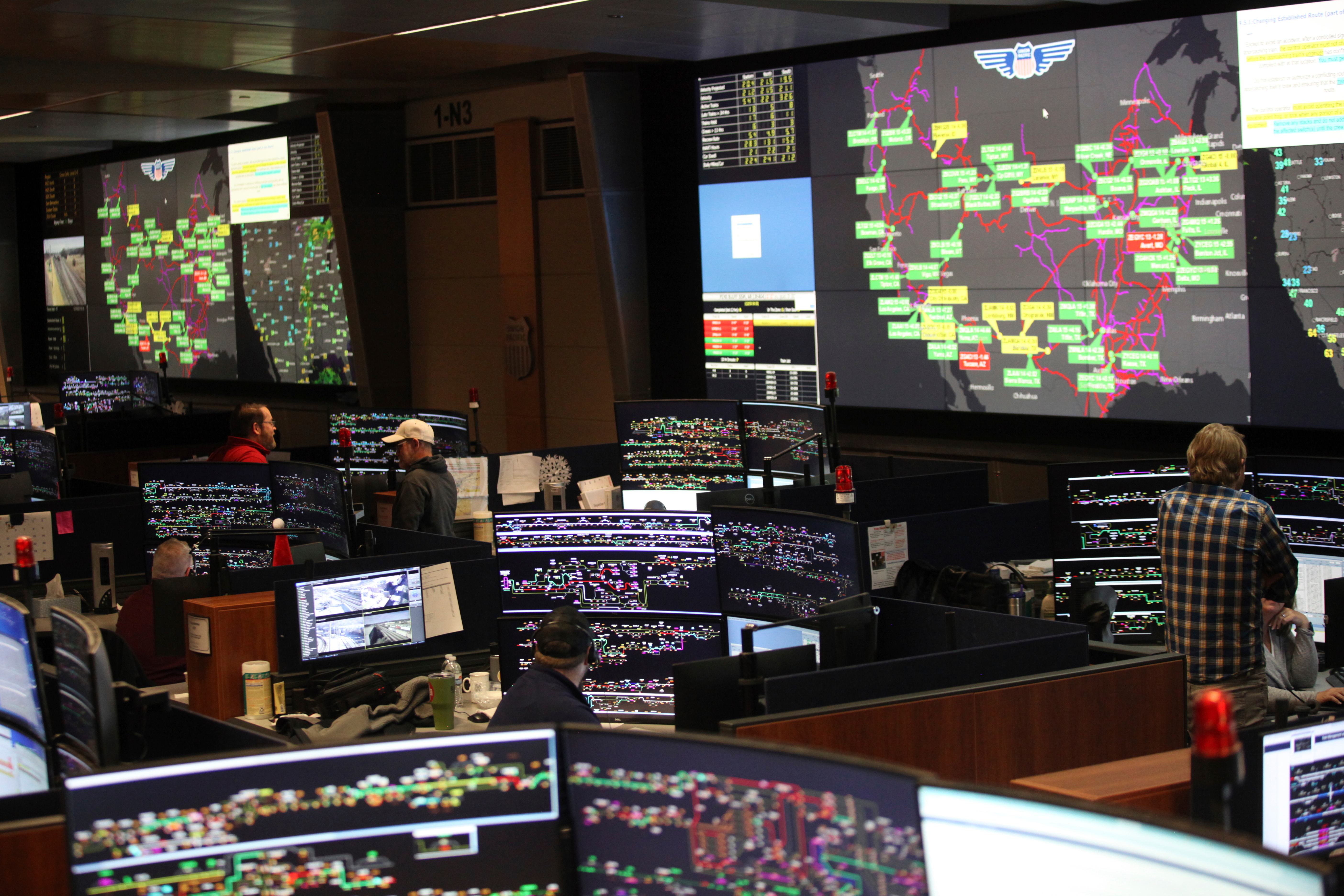 Union Pacific dispatchers keep track of trains moving across the western United States at the Harriman Dispatch Center in Omaha, Neb.