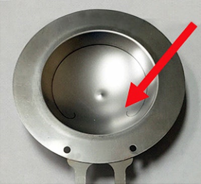 The ‘curl’ at the ends of the circular score line has an engineered geometry that manages the desired opening pattern.