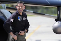 Jared Isaacman, founder and CEO of Shift4 and the commander of Polaris Dawn, stands in front of a plane.