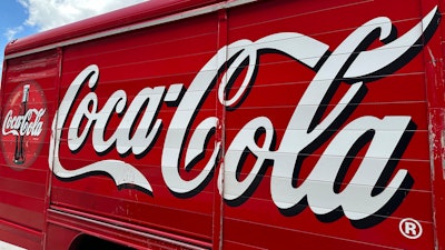 The Coca-Cola logo adorns the side of a delivery truck May 15, 2024, in southeast Denver. Coca-Cola reports earnings on Tuesday, July 23, 2024.