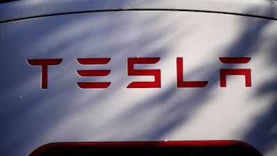 A Tesla charger is seen, Oct. 19, 2022, in Freeport, Maine.