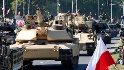 U.S.-made Abrams tanks purchased by Poland take part in a military parade in Warsaw, Poland.