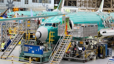 Boeing 737 MAX airplanes are shown on the assembly line during a media tour at the Boeing facility in Renton, Wash.