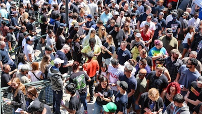 Thousands of Boeing machinists make their way to the exits to cast their vote after the 'stop work meeting' and strike sanction at T-Mobile Park in Seattle, July 17, 2024.