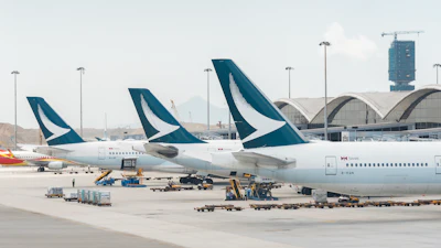 Cathay Pacific airline airplanes grounded at Hong Kong International airport.