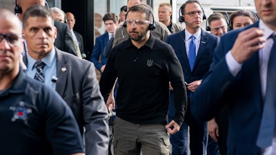 In this photo provided by the U.S. Army, Ukrainian President Volodymyr Zelenskyy, center, tours the Scranton Army Ammunition Plant in Scranton, Pa., Sunday, Sept. 22, 2024.