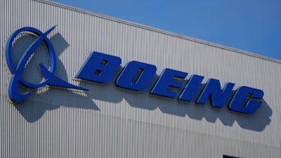 The Boeing logo is displayed at the company's factory Tuesday, Sept. 24, 2024, in Renton, Wash.