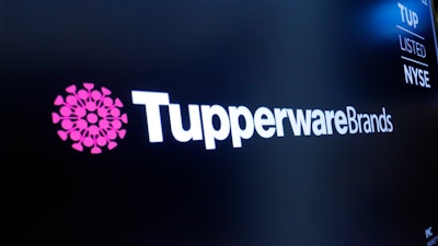 The logo for Tupperware Brands appears above a trading post on the floor of the New York Stock Exchange on Oct. 30, 2019.