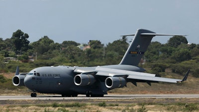 A United States Air Force C-17 cargo plane loaded with humanitarian aid lands at Camilo Daza airport in Cucuta, Colombia, on Feb. 16, 2019.