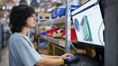 A Winston Industries worker interacting with Pico instructions.