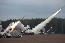 Defense missiles being launched during a military training exercise.