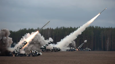 Defense missiles being launched during a military training exercise.