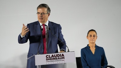 Mexico's former Foreign Affairs Secretary Marcelo Ebrard speaks at the press conference announcing incoming President Claudia Sheinbaum's Cabinet members, in Mexico City, June 20, 2024. Sheinbaum, right, chose Ebrard as her administration's economy secretary.