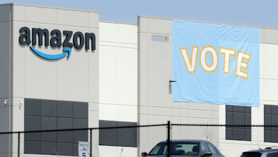 A banner encouraging workers to vote in labor balloting at an Amazon warehouse in Bessemer, Ala., March 30, 2021.