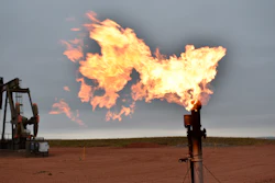 A flare burns natural gas at an oil well in Watford City, N.D., Aug. 26, 2021.