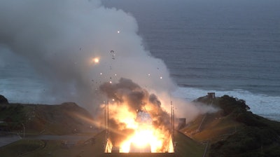 In this photo provided by Japan Aerospace Exploration Agency (JAXA), smoke and fire are seen during a combustion test of an engine for new small Japanese rocket Epsilon S at Tanegashima Space Center, Kagoshima prefecture, southern Japan, Tuesday, Nov. 26, 2024.