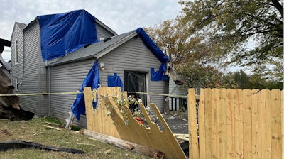 A residential fence near a Louisville, Kentucky, plant that exploded, Nov. 13, 2024.