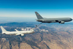 The KC-46A Tanker refueling another plane in midair.
