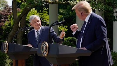 Mexico's President Andres Manuel Lopez Obrador, left, and President Donald Trump hold a joint news conference at the White House in Washington, July 8, 2020.