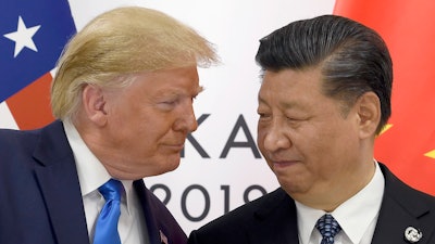 In this Saturday, June 29, 2019, file photo, U.S. President Donald Trump, left, meets with Chinese President Xi Jinping during a meeting on the sidelines of the G-20 summit in Osaka, Japan.