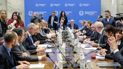Executives from Stellantis and economic, labor and economic development ministers sit during a meeting held at the Ministry of Enterprise and Made in Italy in Rome, Tuesday, Dec. 17, 2024.