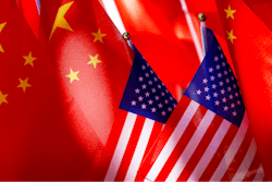 American flags are displayed with Chinese flags on top of a trishaw on Sept. 16, 2018, in Beijing.