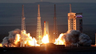 This photo released by the official website of the Iranian Defense Ministry on Friday, Dec. 6, 2024, shows the launching of Simorgh, or 'Phoenix,' rocket at Iran's Imam Khomeini Spaceport in rural Semnan province, Iran.
