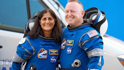 NASA astronauts Suni Williams, left, and Butch Wilmore stand together for a photo enroute to the launch pad at Space Launch Complex 41 Wednesday, June 5, 2024, in Cape Canaveral, Fla., for their liftoff on the Boeing Starliner capsule to the international space station.