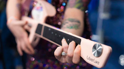 LiberLive showcases their stringless guitar at 2025 CES Unveiled, Sunday, Jan. 5, 2025, in Las Vegas.