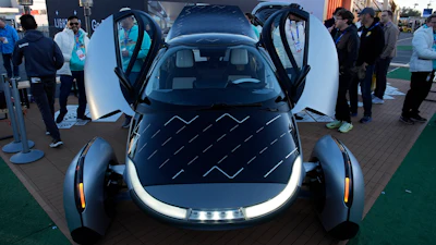 People look at a prototype solar electric vehicle by Aptera Motors during the CES tech show Tuesday, Jan. 7, 2025, in Las Vegas.