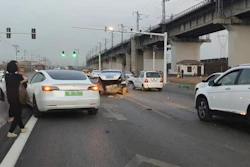 This photo provided by Zhang Yazhou shows her damaged Tesla Model 3, left, which her father was driving when it hit two other cars before crashing to a halt against a concrete barrier in Anyang, a city in central China’s Henan province, on Feb. 21, 2021. Zhang was in the passenger seat. Her mother and her one-year-old niece were at the back.