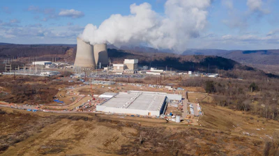 A data center owned by Amazon Web Services, front right, is under construction next to the Susquehanna nuclear power plant in Berwick, Pa., on Tuesday, Jan. 14, 2024.