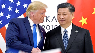 President Donald Trump, left, shakes hands with China's President Xi Jinping during a meeting on the sidelines of the G-20 summit in Osaka, Japan, June 29, 2019.