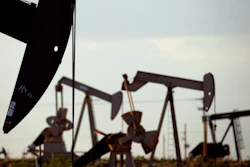 Pumpjacks work in a field near Lovington, N.M., on April 24, 2015.
