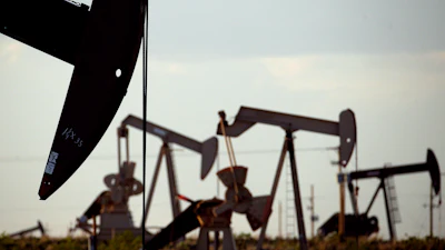 Pumpjacks work in a field near Lovington, N.M., on April 24, 2015.