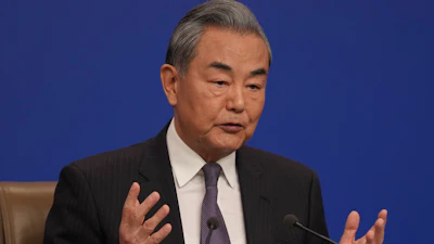 Chinese Foreign Minister Wang Yi speaks during a press conference on the sideline of the National People's Congress in Beijing, Friday, March 7, 2025.