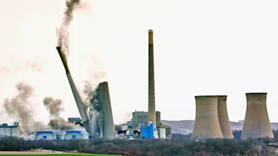 The smokestacks of the former coal-fired Homer City Generating Station crumble in a planned demolition to make way for a new natural gas-fired power plant in Homer City, Pa., Saturday, March 22, 2025.