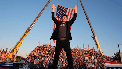 Tesla and SpaceX CEO Elon Musk walks to the stage to speak at the Butler Farm Show, Oct. 5, 2024, in Butler, Pa.