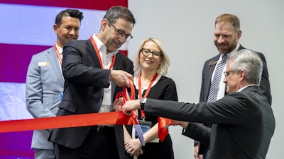 Joe Bogosian, CEO of Safran Defense & Space, Inc. (Safran DSI), cuts the ribbon during the inauguration for the company’s new manufacturing facility in Parker, Colorado.