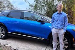 Rob Blackwell stands next to an EV he started leasing right before U.S. President Donald Trump announced expansive new import tariffs, in Richmond, Va., on April 3, 2025.
