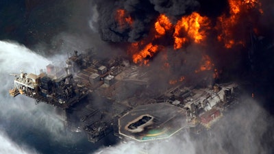 A plume of smoke rises from fires on BP's Deepwater Horizon offshore oil rig in the Gulf of Mexico on April 21, 2010.