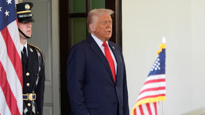 President Donald Trump waits to greet El Salvador's President Nayib Bukele at the White House, Monday, April 14, 2025, in Washington.