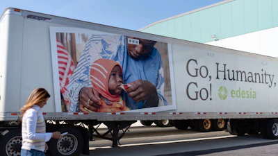 Edesia Nutrition CEO Navyn Salem walks past a delivery truck sitting idle at the company's North Kingstown, R.I. facility where they make Plumpy'Nut, a nutritional lifesaving peanut paste sent to malnourished children worldwide, Friday, March 14, 2025.
