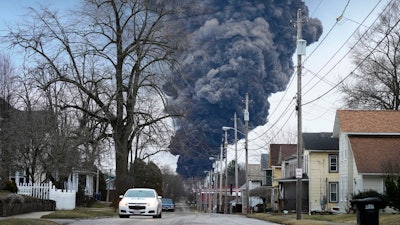 A black plume rises over East Palestine, Ohio, as a result of a controlled detonation of a portion of the derailed Norfolk Southern trains Monday, Feb. 6, 2023.