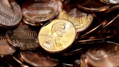 Freshly-made pennies sit in a bin at the U.S. Mint in Denver on Aug. 15, 2007.