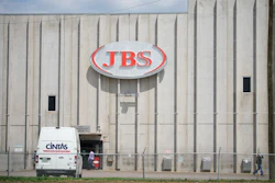 In this Friday, July 22, 2021, photograph, employees move into an entrance to the JBS meat processing plant in Greeley, Colo.