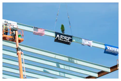 Construction crews prepare to mount the final structural steel beam on the 1.6 million-square-foot AESC gigafactory being constructed in the Kentucky Transpark in Bowling Green, Ky., during the facility's 'Topping Out' structural completion milestone ceremony on Thursday, Sept. 14, 2023.
