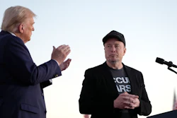 Republican presidential nominee former President Donald Trump, left, claps as Tesla and SpaceX CEO Elon Musk prepares to depart after a campaign event at the Butler Farm Show on Oct. 5, 2024, in Butler, Pa.
