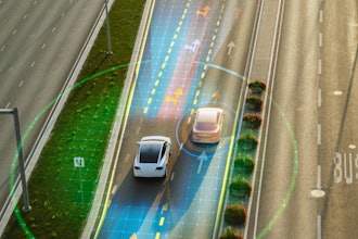 Autonomous vehicles with digital sensor visualization on multi-lane highway.