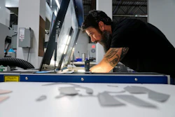 Craig Simile, senior operations manager at Made Plus, prepares materials with a laser cutting machine at the company's manufacturing facility in Annapolis, Md., Tuesday, June 10, 2025.